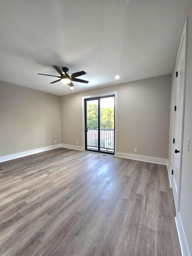 unfurnished room with ceiling fan and light hardwood / wood-style flooring