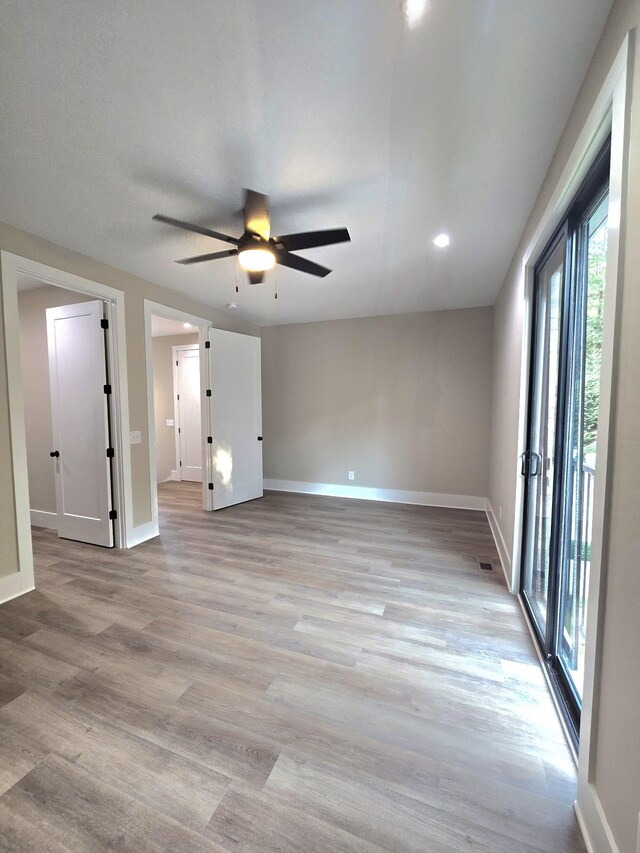 interior space featuring light hardwood / wood-style flooring and ceiling fan