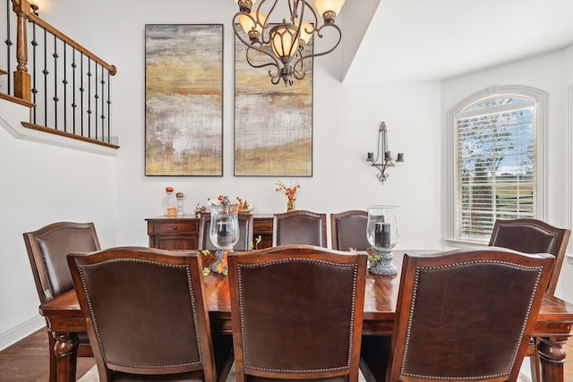 dining area featuring a chandelier and dark hardwood / wood-style flooring