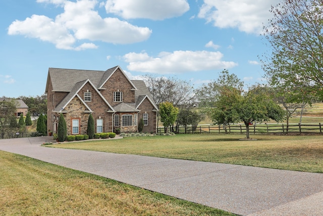 view of front of home with a front lawn