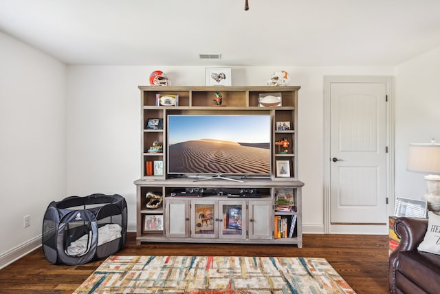 living room with dark hardwood / wood-style flooring