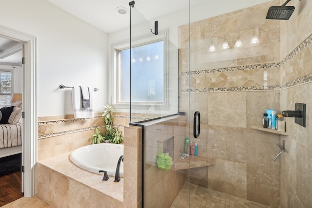 bathroom featuring independent shower and bath and hardwood / wood-style flooring