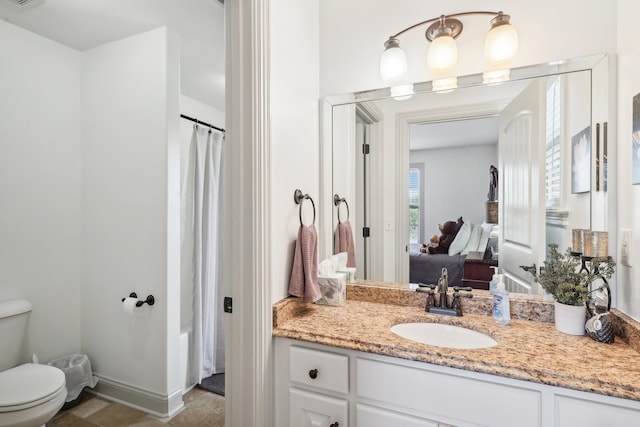 bathroom with vanity and toilet