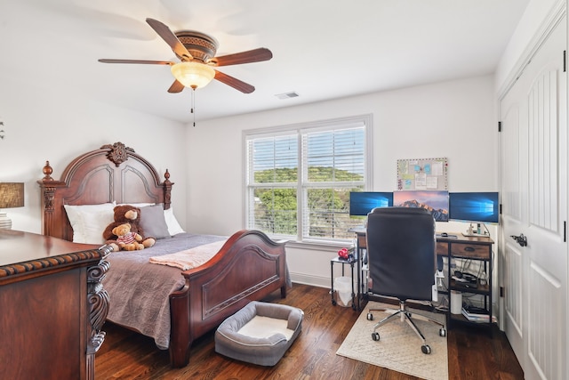 bedroom with ceiling fan and dark wood-type flooring