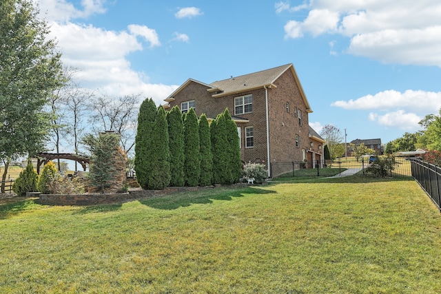 view of side of property with a lawn