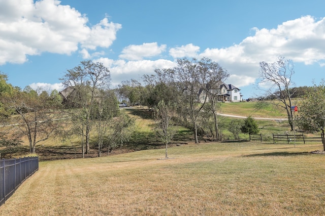 view of yard with a rural view