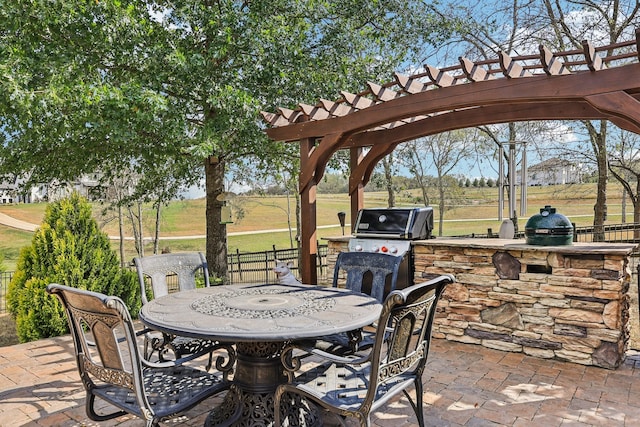 view of patio / terrace with area for grilling, grilling area, and a pergola