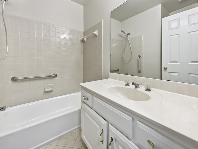 bathroom with vanity, tile patterned floors, and tiled shower / bath