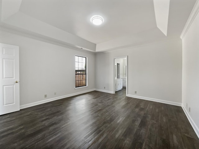 1515 Brentwood Pointe, Franklin, TN 37067 - unfurnished room with a tray ceiling, dark wood-style floors, and baseboards