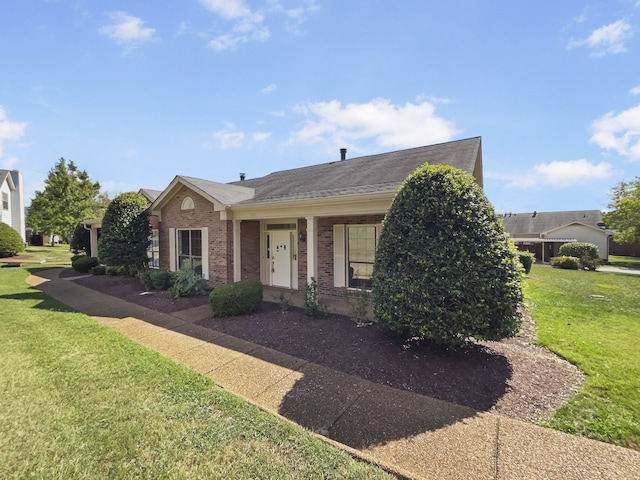 ranch-style house with a front lawn