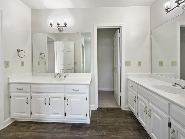 bathroom featuring hardwood / wood-style flooring and vanity