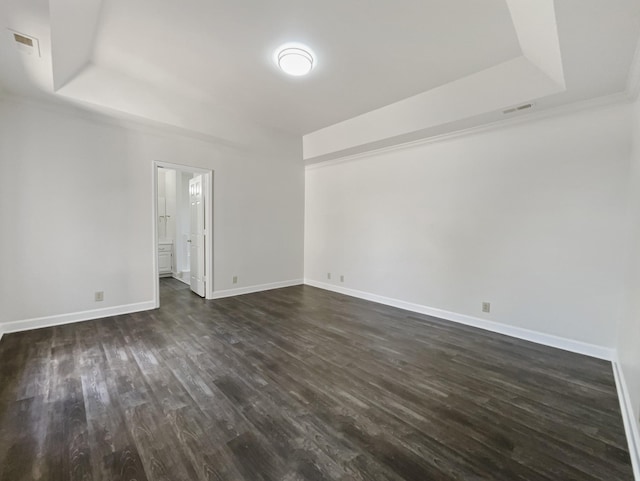 1515 Brentwood Pointe, Franklin, TN 37067 - spare room with dark wood finished floors, baseboards, visible vents, and a raised ceiling
