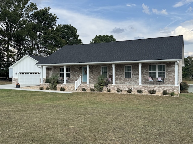 view of front of property featuring a garage and a front lawn