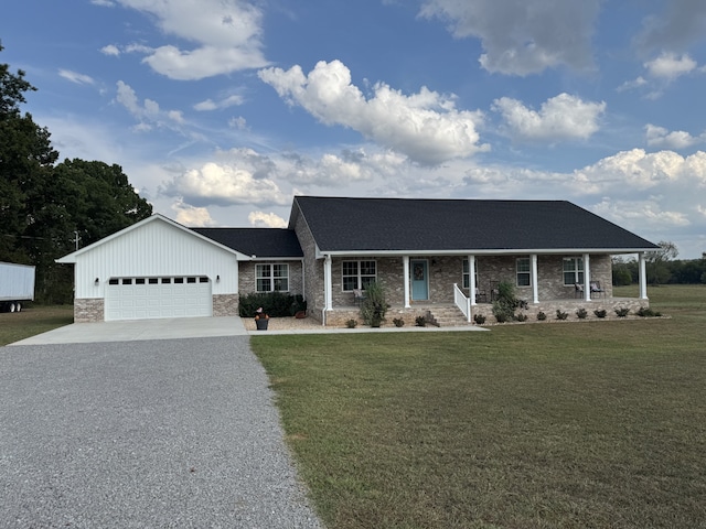 view of front of home with a garage and a front lawn