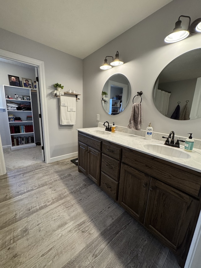 bathroom featuring vanity and hardwood / wood-style floors