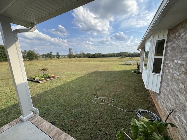 view of yard with a rural view