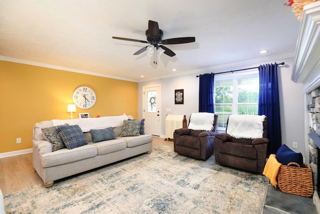 living room featuring ceiling fan, crown molding, and hardwood / wood-style floors