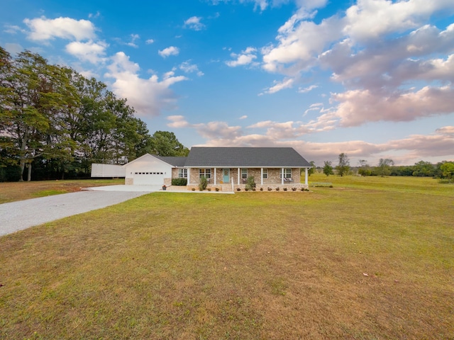 ranch-style house with a front yard, a garage, and a porch