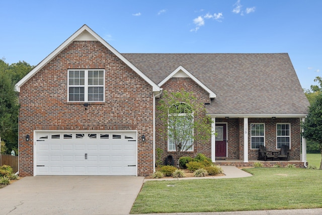 view of front of house featuring a garage and a front yard