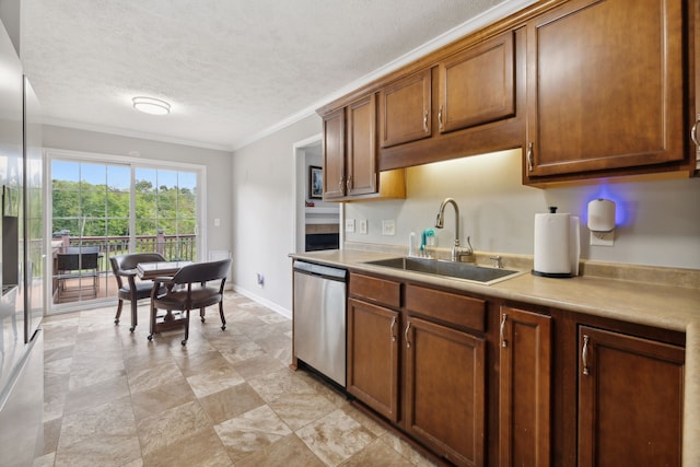 kitchen with ornamental molding, a textured ceiling, sink, and stainless steel dishwasher