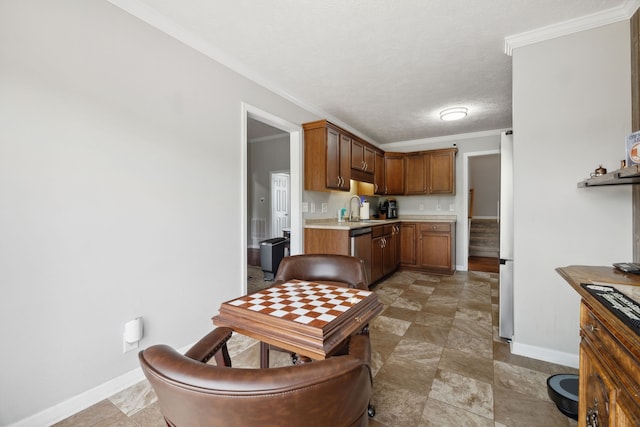 kitchen with a textured ceiling, dishwasher, crown molding, and sink