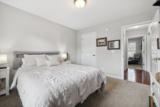 bedroom with dark carpet