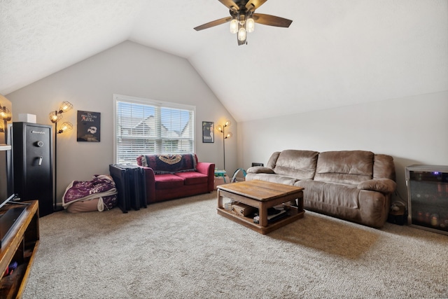 living room with carpet floors, vaulted ceiling, and ceiling fan