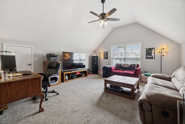 interior space featuring a textured ceiling, carpet, vaulted ceiling, and ceiling fan