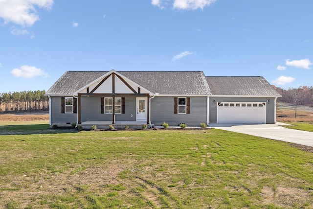 view of front of property featuring a front lawn, a porch, and a garage