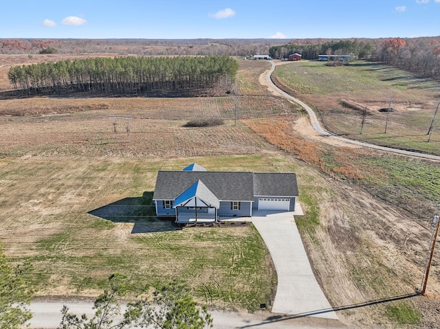 birds eye view of property with a rural view