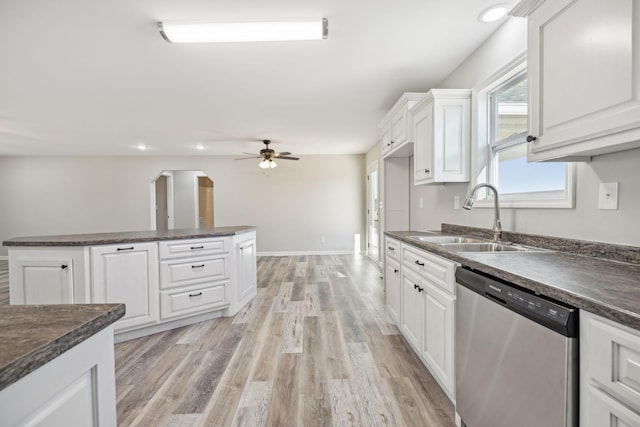 kitchen with white cabinetry, sink, ceiling fan, light hardwood / wood-style flooring, and stainless steel dishwasher