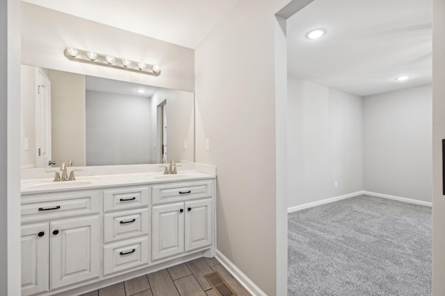 bathroom featuring hardwood / wood-style floors and vanity