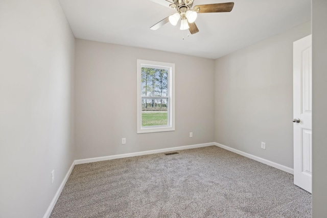 spare room with carpet flooring and ceiling fan