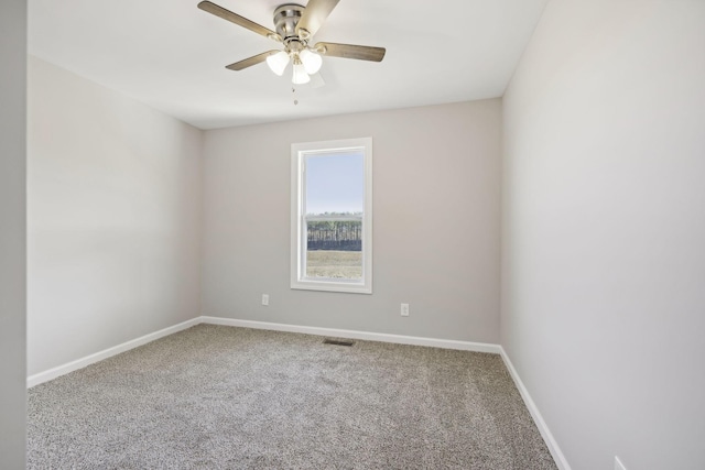 empty room with carpet and ceiling fan