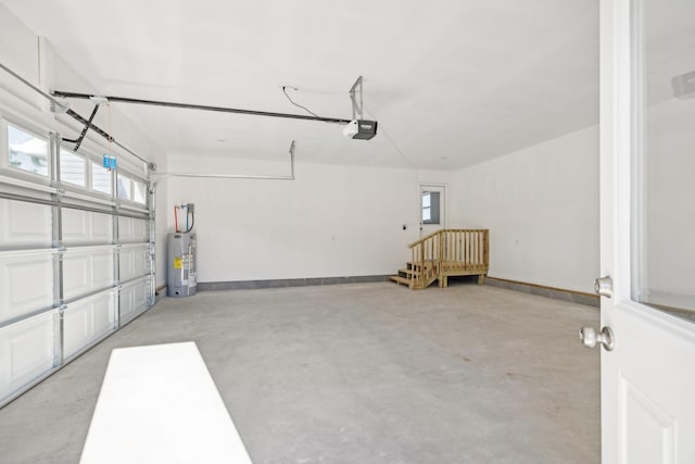 garage with a garage door opener and water heater