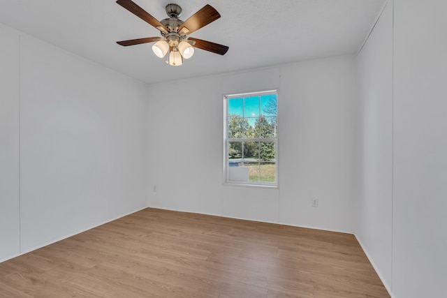 spare room featuring ceiling fan and light hardwood / wood-style flooring