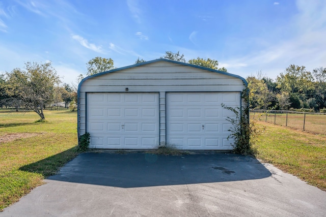 garage with a lawn