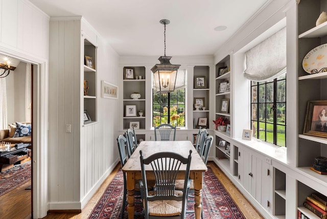 2304 Valley Brook Rd, Nashville, TN 37215 - dining space featuring light wood finished floors, a notable chandelier, and built in shelves