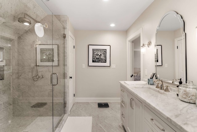 bathroom with an enclosed shower and vanity