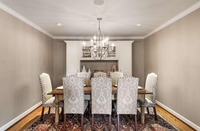 2304 Valley Brook Rd, Nashville, TN 37215 - dining room featuring baseboards, a chandelier, ornamental molding, and light wood-style floors