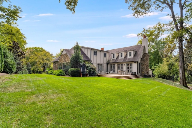 2304 Valley Brook Rd, Nashville, TN 37215 - rear view of house with a chimney, a lawn, a wooden deck, and stone siding