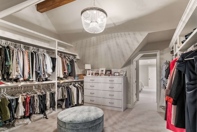 walk in closet with vaulted ceiling with beams, light colored carpet, and a notable chandelier