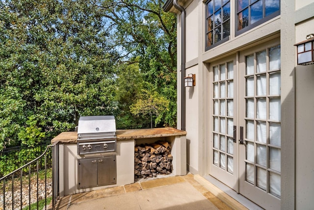 view of patio / terrace featuring area for grilling and an outdoor kitchen