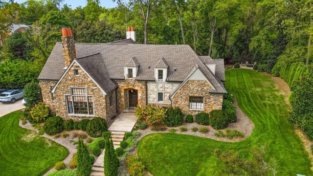 2304 Valley Brook Rd, Nashville, TN 37215 - view of front facade with a front yard, a chimney, and stone siding
