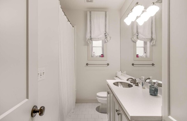 2304 Valley Brook Rd, Nashville, TN 37215 - full bath featuring vanity, tile patterned flooring, a wealth of natural light, and toilet
