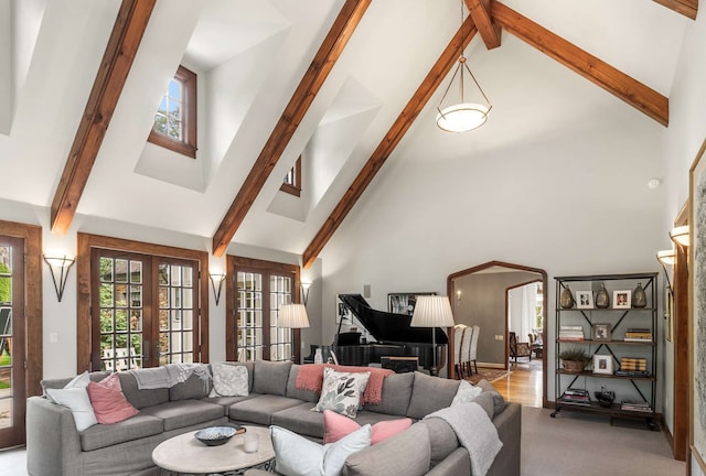 living room featuring beam ceiling, french doors, and high vaulted ceiling