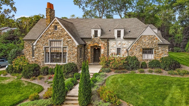 2304 Valley Brook Rd, Nashville, TN 37215 - english style home featuring roof with shingles, a chimney, stone siding, and a front lawn