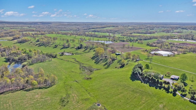 drone / aerial view with a water view and a rural view