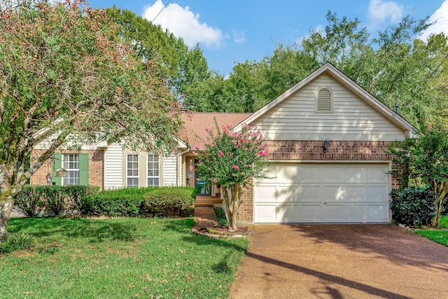 view of front of house featuring a front yard and a garage