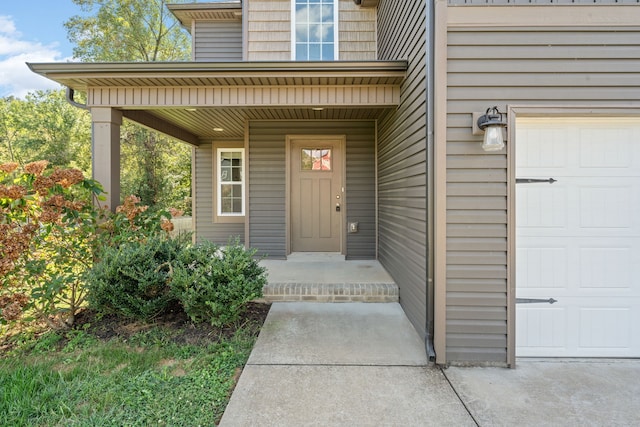 entrance to property featuring a garage